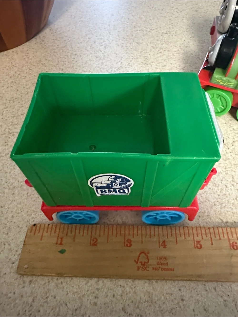 Green Percy the Small Engine toys and cargo cars from Thomas & Friends.